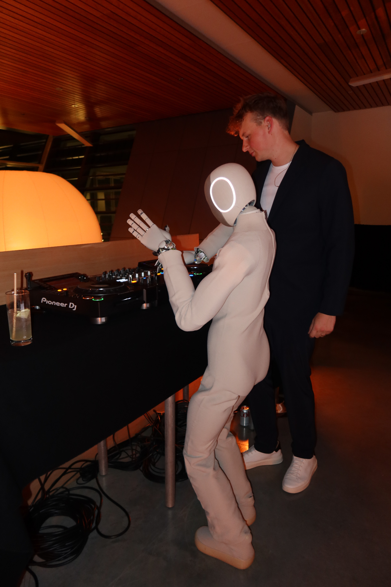 Robot performer at a DJ booth
